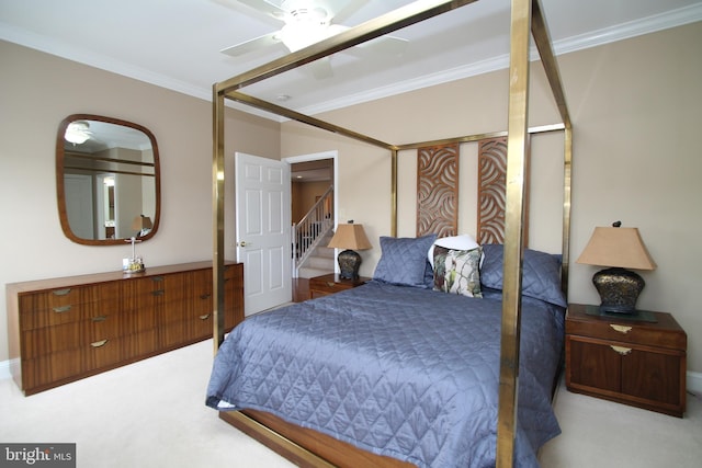 bedroom featuring light carpet, baseboards, and ornamental molding