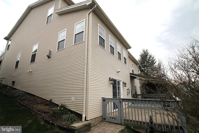 view of side of property with a deck