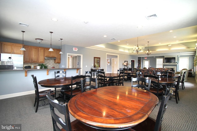 dining space with recessed lighting, carpet floors, and visible vents