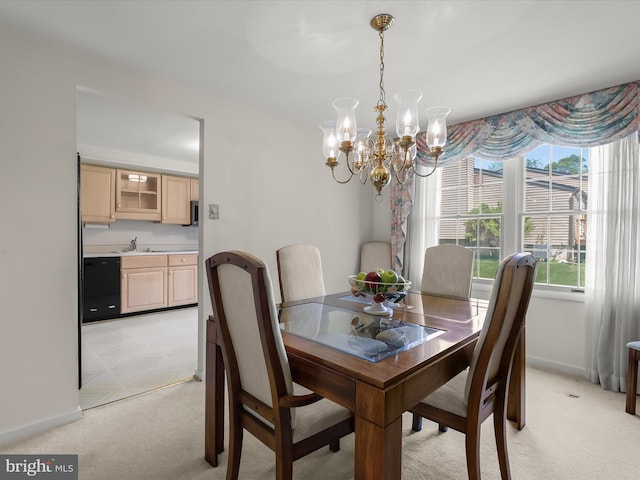 dining space featuring baseboards, a wealth of natural light, light carpet, and a chandelier