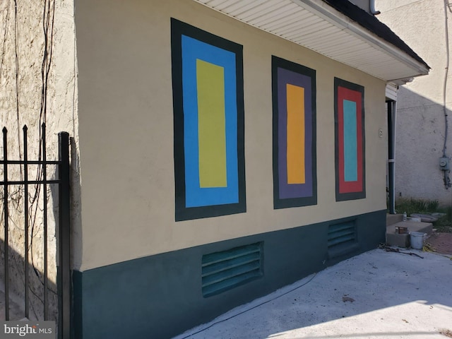 view of side of property featuring stucco siding