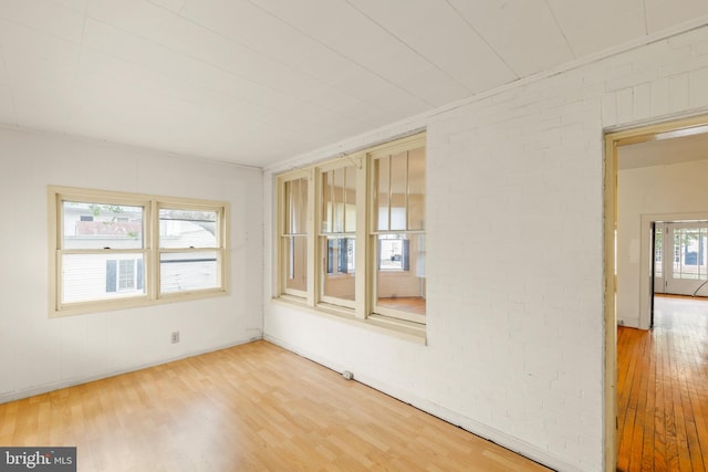 5342 Main St, Stephens City, VA 22655 - unfurnished room featuring wood finished floors, baseboards, and brick wall
