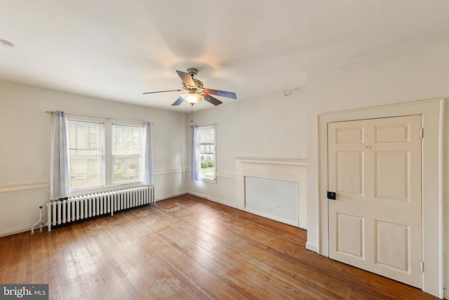 5342 Main St, Stephens City, VA 22655 - unfurnished living room featuring radiator, ceiling fan, and wood finished floors