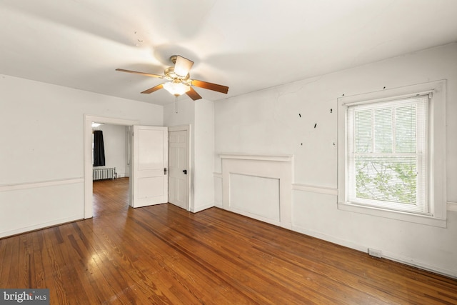 5342 Main St, Stephens City, VA 22655 - unfurnished living room featuring radiator heating unit, ceiling fan, and hardwood / wood-style floors