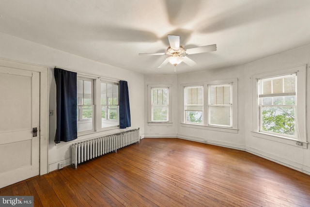 5342 Main St, Stephens City, VA 22655 - spare room featuring radiator heating unit, ceiling fan, and wood-type flooring
