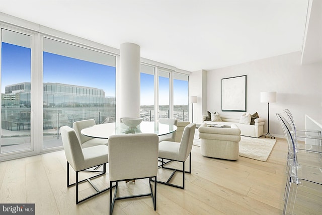 601 Wharf St SW Unit 502, Washington, DC 20024 - dining space featuring light wood-style flooring and a wall of windows