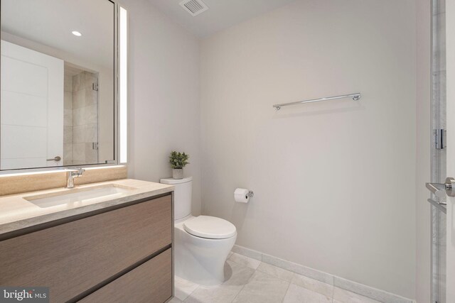 601 Wharf St SW Unit 502, Washington, DC 20024 - bathroom featuring vanity, baseboards, tile patterned floors, toilet, and visible vents