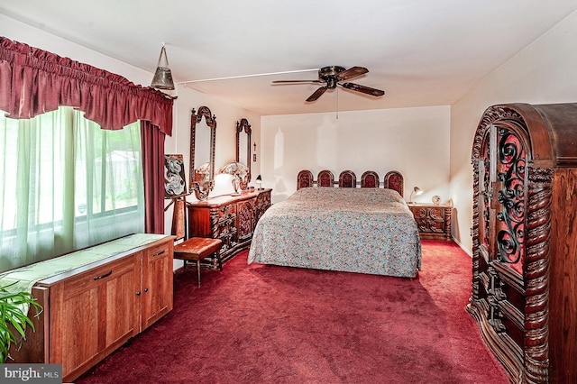 bedroom with dark carpet and ceiling fan