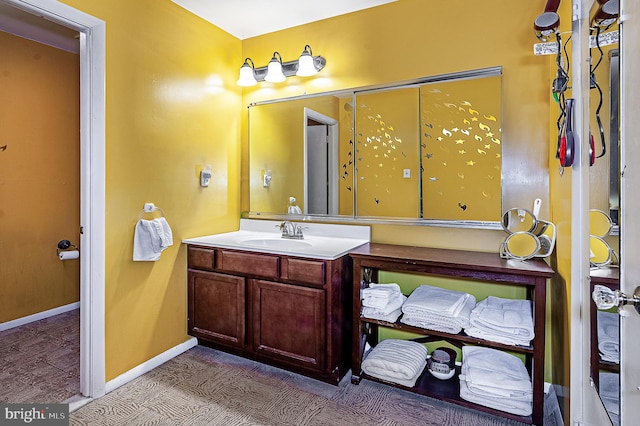 bathroom featuring vanity and baseboards