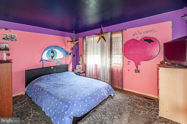 bedroom featuring carpet flooring and baseboards