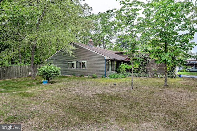 view of home's exterior with a chimney
