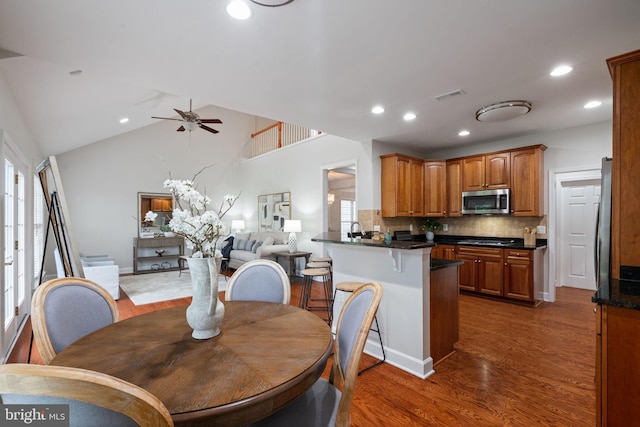 dining room with wood finished floors, visible vents, recessed lighting, and a ceiling fan