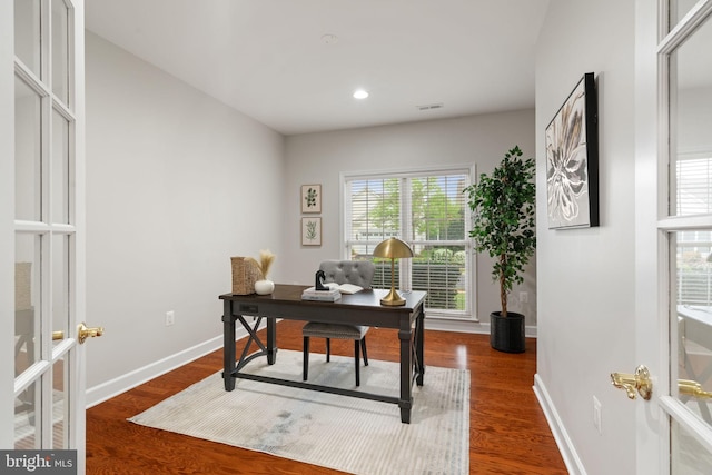 office space with recessed lighting, wood finished floors, visible vents, french doors, and baseboards
