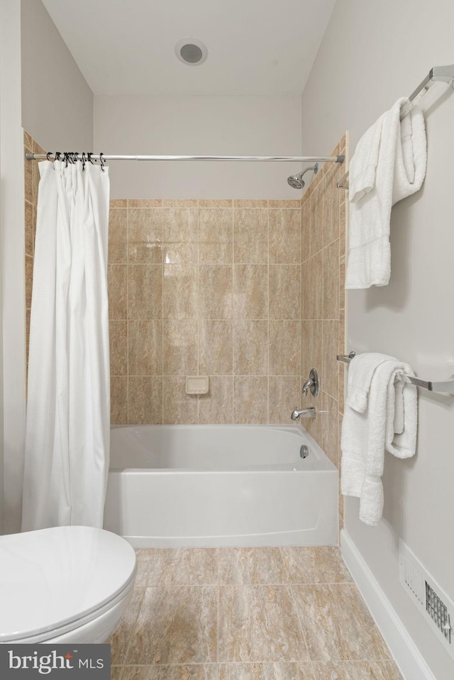 full bath with visible vents, toilet, and shower / bathtub combination with curtain
