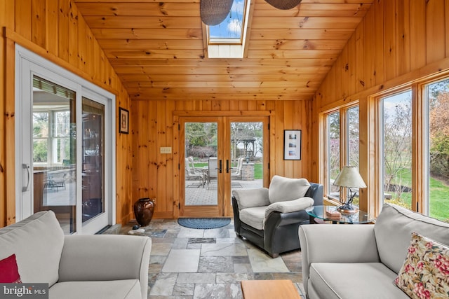 sunroom / solarium with a skylight and french doors