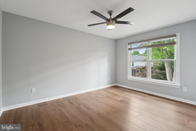 13126 Pelmira Ridge Ct, Herndon, VA 20171 - unfurnished room featuring baseboards, wood finished floors, and ceiling fan
