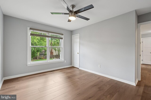 13126 Pelmira Ridge Ct, Herndon, VA 20171 - spare room featuring a ceiling fan, baseboards, and wood finished floors
