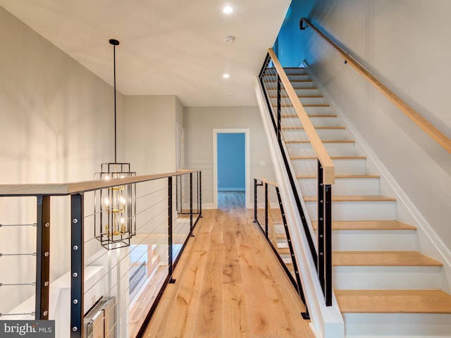 1021 E Palmer St, Philadelphia, PA 19125 - stairway featuring wood finished floors, a chandelier, recessed lighting, and baseboards