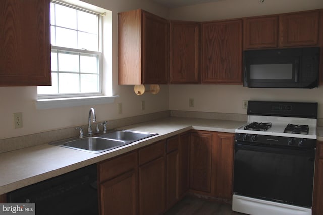 144 Zachary Dr, Hanover, PA 17331 - kitchen featuring black appliances, a sink, light countertops, and brown cabinets