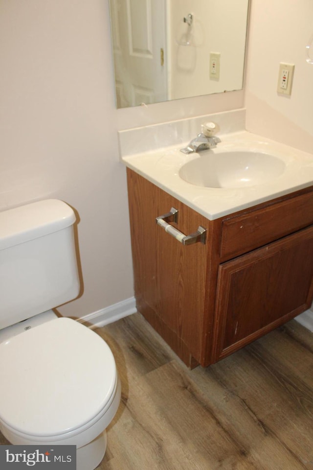 144 Zachary Dr, Hanover, PA 17331 - half bath with wood finished floors, vanity, toilet, and baseboards