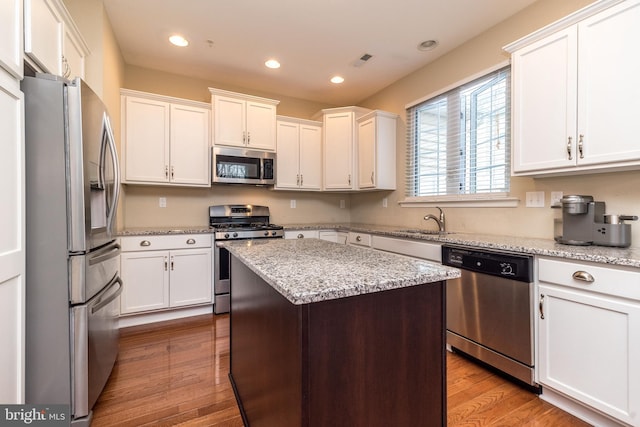 411 Cope Ct, Sellersville, PA 18960 - kitchen with a sink, stainless steel appliances, white cabinetry, visible vents, and recessed lighting
