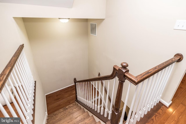 411 Cope Ct, Sellersville, PA 18960 - stairs featuring visible vents, baseboards, and wood finished floors
