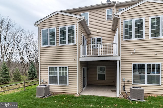 411 Cope Ct, Sellersville, PA 18960 - back of house featuring fence, a balcony, a yard, central air condition unit, and a patio area
