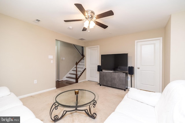 411 Cope Ct, Sellersville, PA 18960 - living area with visible vents, stairs, baseboards, light colored carpet, and ceiling fan