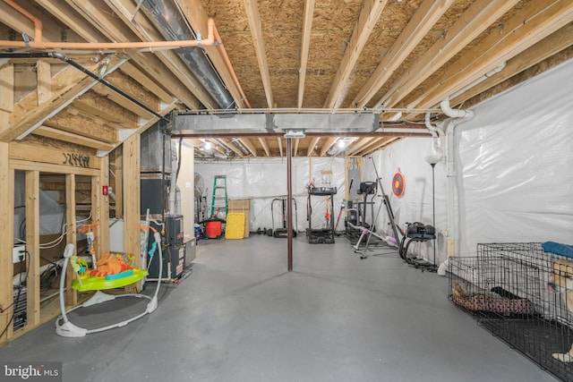 unfinished basement with heating unit