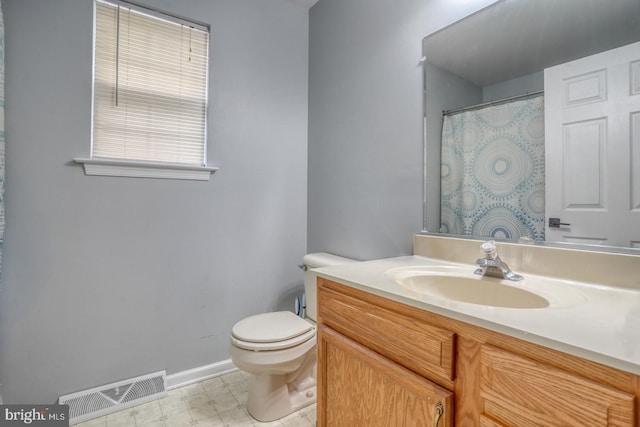 full bath featuring visible vents, vanity, toilet, baseboards, and tile patterned floors