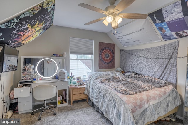 bedroom with carpet floors, a ceiling fan, and lofted ceiling