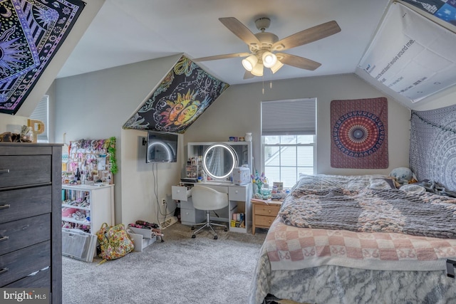carpeted bedroom with ceiling fan and lofted ceiling