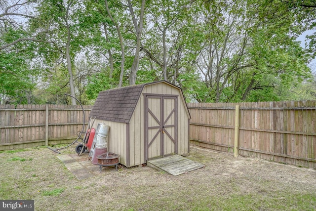 view of shed featuring a fenced backyard