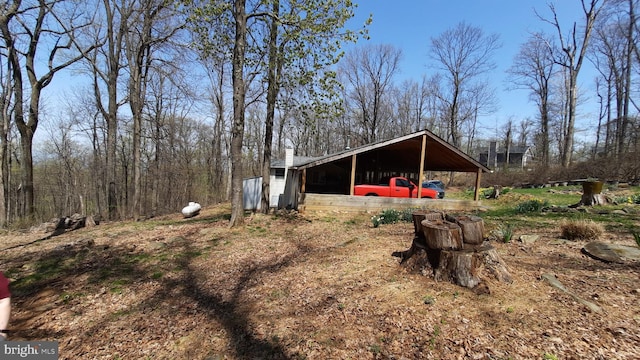 view of yard with a carport