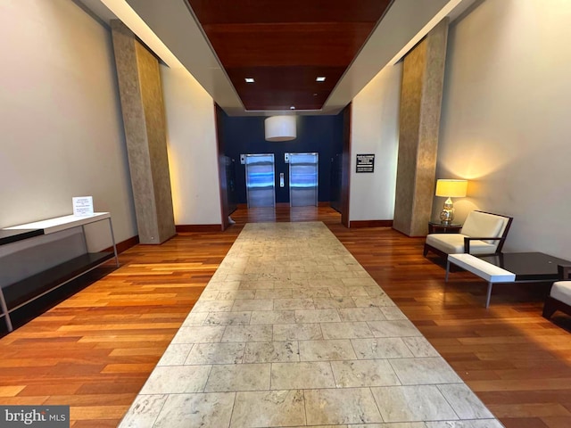 1209 N Charles St N Unit 209, Baltimore, MD 21201 - corridor with wood finished floors, wooden ceiling, baseboards, and a tray ceiling