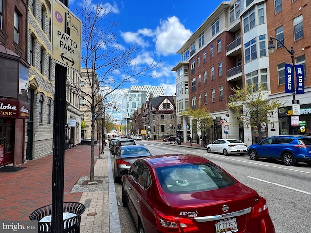 1209 N Charles St N Unit 209, Baltimore, MD 21201 - view of asphalt street featuring street lighting, sidewalks, and curbs