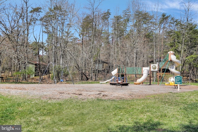 community jungle gym featuring a yard