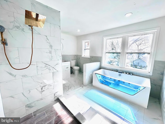 580 Bath St, Bristol, PA 19007 - full bath with tile walls, a freestanding bath, tiled shower, marble finish floors, and wainscoting