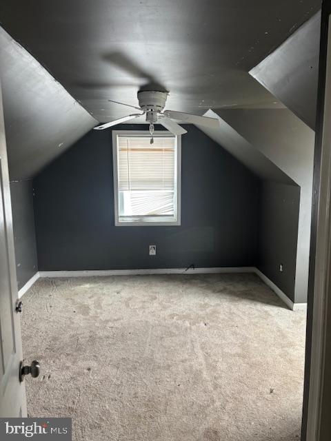bonus room with carpet floors, ceiling fan, baseboards, and lofted ceiling