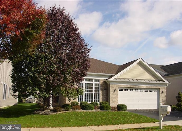 35 Galileo Dr, Cranbury, NJ 08512 - view of front of property with aphalt driveway, a garage, a standing seam roof, a front yard, and metal roof