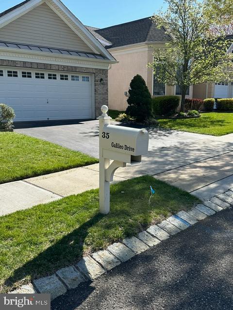 35 Galileo Dr, Cranbury, NJ 08512 - view of front of home featuring a front yard and aphalt driveway