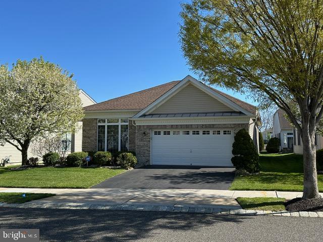 35 Galileo Dr, Cranbury, NJ 08512 - ranch-style house featuring an attached garage, driveway, and a front yard