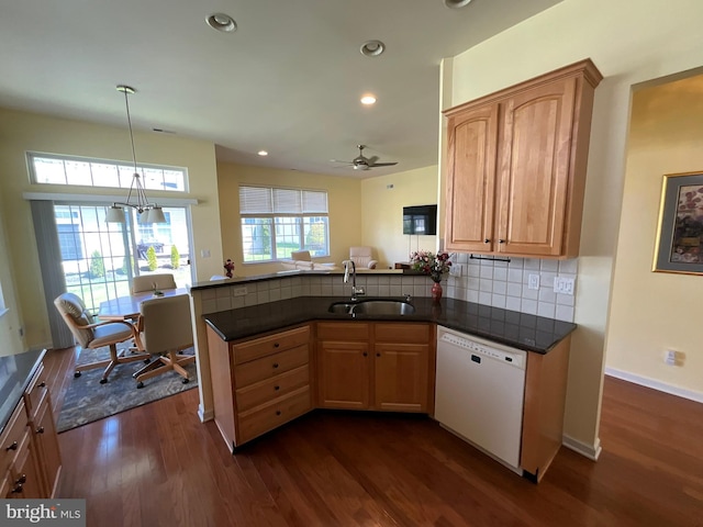 35 Galileo Dr, Cranbury, NJ 08512 - kitchen featuring dark countertops, a sink, white dishwasher, dark wood-type flooring, and a peninsula