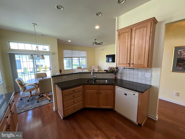35 Galileo Dr, Cranbury, NJ 08512 - kitchen featuring dark countertops, white dishwasher, a sink, a peninsula, and dark wood-type flooring
