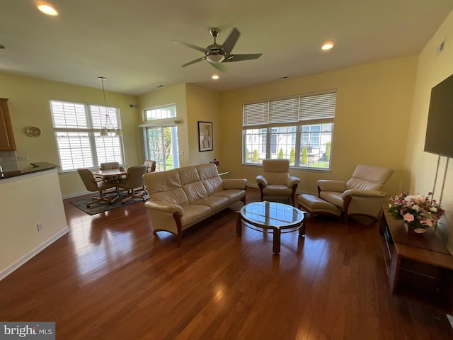 35 Galileo Dr, Cranbury, NJ 08512 - living area featuring baseboards, dark wood-style floors, and a healthy amount of sunlight