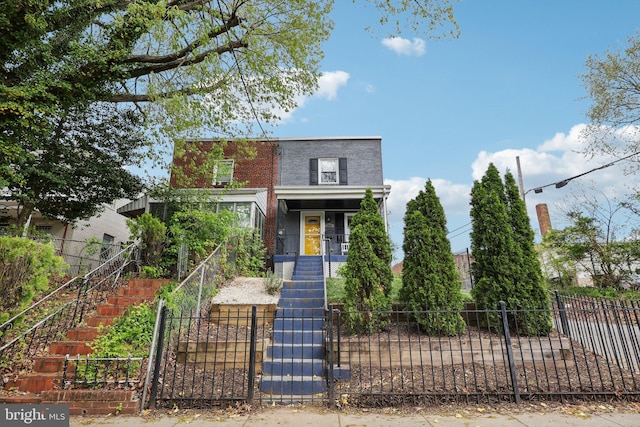 2026 Savannah Pl SE, Washington, DC 20020 - view of front facade featuring a gate, a fenced front yard, a porch, and stairway