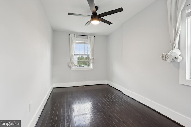 2026 Savannah Pl SE, Washington, DC 20020 - unfurnished room with baseboards, a ceiling fan, dark wood-style flooring, and visible vents
