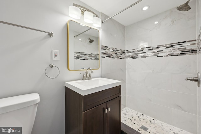 2026 Savannah Pl SE, Washington, DC 20020 - full bathroom with recessed lighting, vanity, toilet, and tiled shower