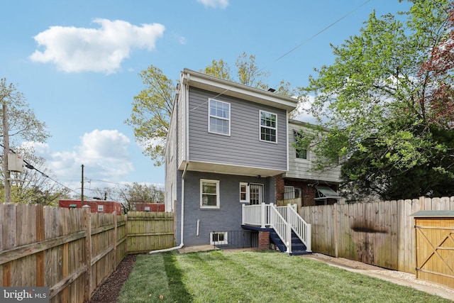 2026 Savannah Pl SE, Washington, DC 20020 - rear view of property featuring brick siding, a lawn, and a fenced backyard
