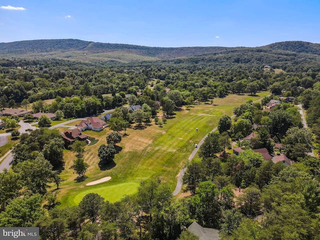 birds eye view of property featuring a mountain view, a residential view, and a view of trees